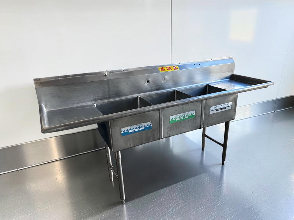 Flawless Condition – Commercial Three-Compartment Stainless Steel Sink – Dual Drainboards – High Backsplash – Adjustable Legs – Fully Inspected & Ready for Installation!