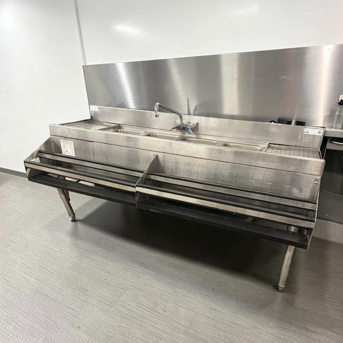 Exceptional Condition – Commercial Stainless Steel 4-Compartment Underbar Sink – 72" × 29" × 33" – Dual Drainboards, Faucet & Double Speed Rails – Fully Inspected & Ready for Installation!
