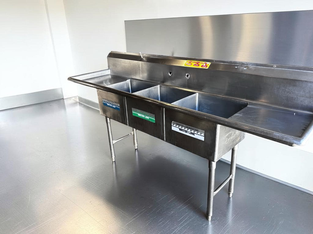 Flawless Condition – Commercial Three-Compartment Stainless Steel Sink – Dual Drainboards – High Backsplash – Adjustable Legs – Fully Inspected & Ready for Installation!